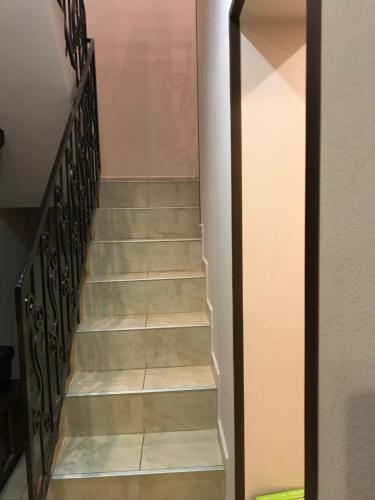 a flight of stairs in a house at Zatishok Guest House in Rakhiv