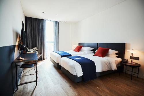Cama o camas de una habitación en La Casa hotel Gwangmyeong