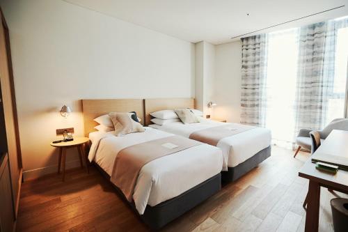Cama o camas de una habitación en La Casa hotel Gwangmyeong