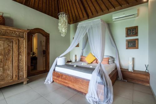 Cama o camas de una habitación en Bersantai Villas Lembongan Island