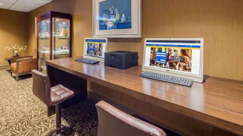 a room with a desk with a laptop on it at Robert Treat Hotel, Premier Collection in Newark