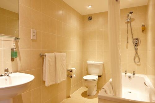 a bathroom with a toilet and a sink and a shower at Linton Lodge a BW Signature Collection Hotel in Oxford