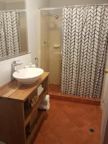 a bathroom with a sink and a shower at Adamsons Riverside Accommodation in Margaret River Town