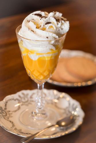 a dessert in a glass on a plate on a table at Lo Tzeno in Fenis