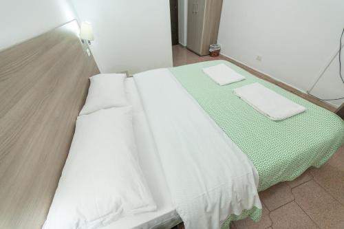 Ένα ή περισσότερα κρεβάτια σε δωμάτιο στο Lemei House