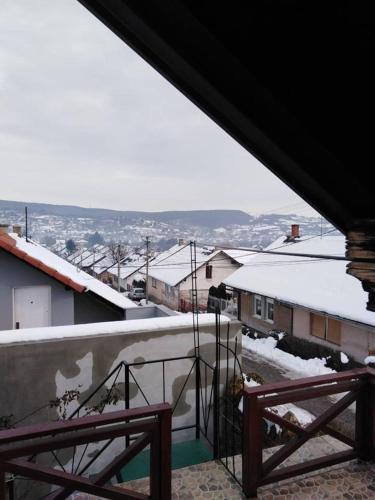 a view from the balcony of a house with snow at Apartman Vrdničak in Vrdnik