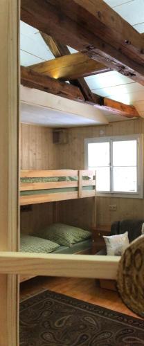 a room with several bunk beds in a room at Chalet anno 1794 in Rettenegg