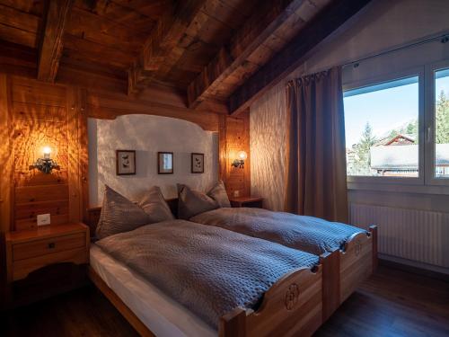 Postel nebo postele na pokoji v ubytování Malteserhaus Zermatt