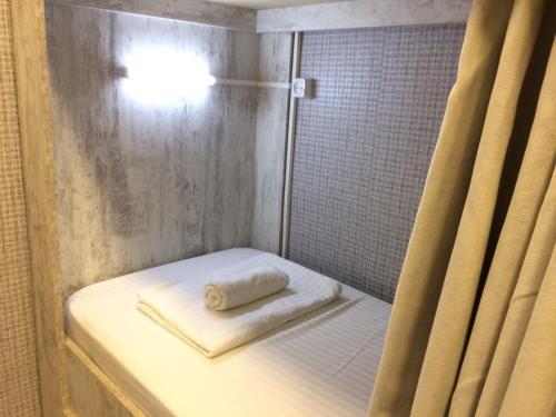 Postel nebo postele na pokoji v ubytování Legvi hostel