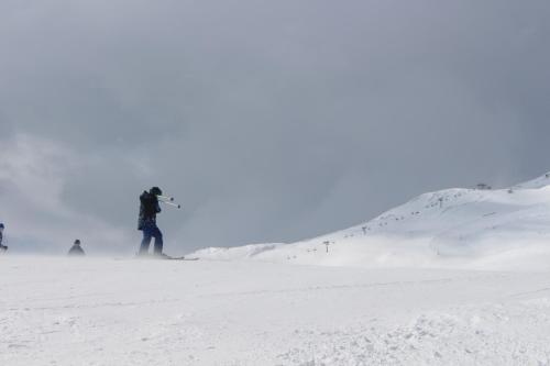 a person is skiing down a snow covered slope at Haus Siegfried in Churwalden