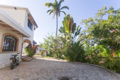 a motorcycle parked in front of a house at Casa Tecolote in Sayulita
