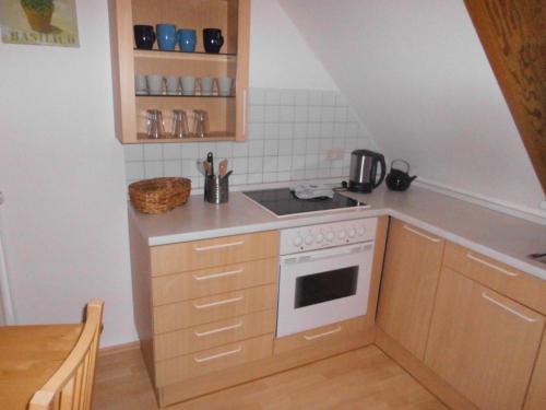 Η κουζίνα ή μικρή κουζίνα στο Ferienwohnung am Selenter See