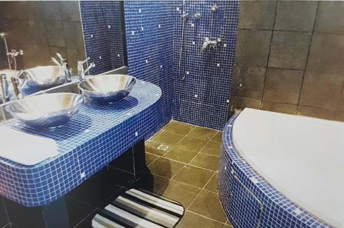 Een badkamer bij Le ZaNaLi Hotel