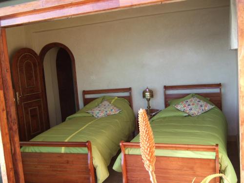 Tempat tidur dalam kamar di Taghazout Beach