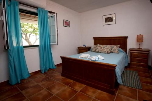 En eller flere senger på et rom på Tapada da Beirã