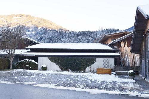 a house with snow on the side of it at Birkenhof in Zell am Ziller
