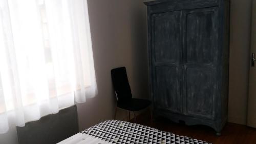 Ένα ή περισσότερα κρεβάτια σε δωμάτιο στο Appartement Taïko