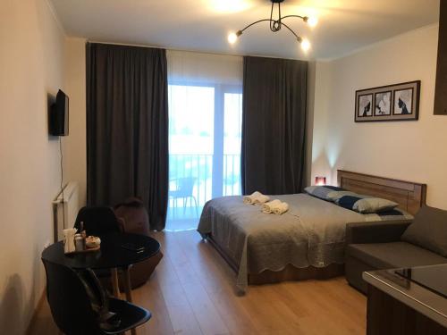 Ένα ή περισσότερα κρεβάτια σε δωμάτιο στο Vista Gudauri Apartment 25