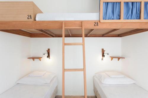 Tempat tidur dalam kamar di BRECHA HOSTEL & ROOFTOP - Maragogi