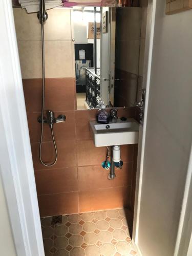 a bathroom with a sink and a mirror at Riad Medina in Marrakesh