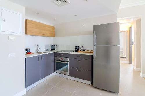 a kitchen with a stainless steel refrigerator at master Haifa in Haifa