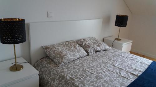 Postel nebo postele na pokoji v ubytování Miradouro de Santa Luzia