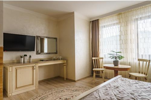Mardan Palace SPA Resortにあるテレビまたはエンターテインメントセンター