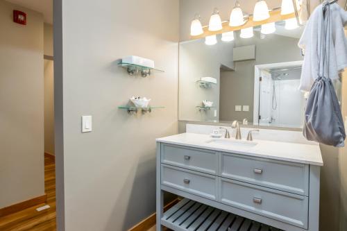 a bathroom with a sink and a mirror at Grey Fox Inn in Stowe