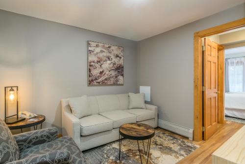 a living room with a couch and a table at Grey Fox Inn in Stowe