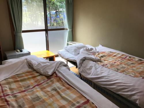 Katil atau katil-katil dalam bilik di Minshuku Nodoka
