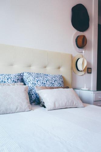 a bedroom with a white bed with pillows on it at Studio Sal in Albufeira