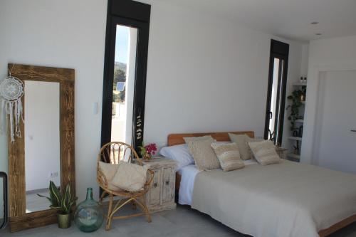 Ένα ή περισσότερα κρεβάτια σε δωμάτιο στο bohospanishvilla