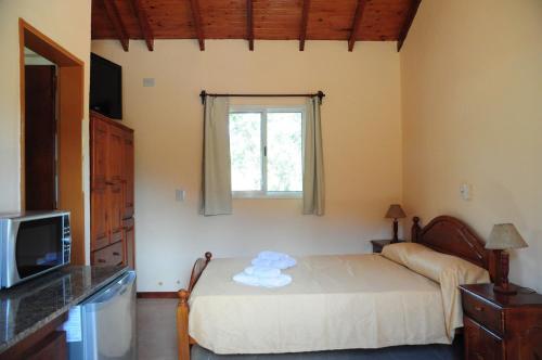 A bed or beds in a room at Corazon de Montaña