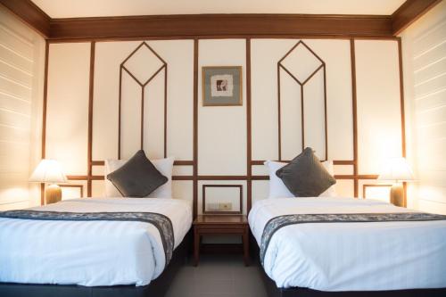 Cama o camas de una habitación en Sea Memories White Sand Beach Hotel