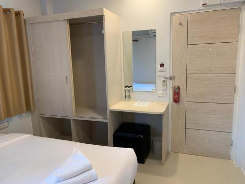 Postel nebo postele na pokoji v ubytování Chiangmun Boutique