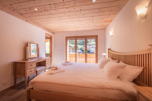 Postel nebo postele na pokoji v ubytování Chalet Aquila 8 Penthouse