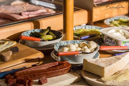 a table topped with lots of different types of food at Haus am Lift in Kappl