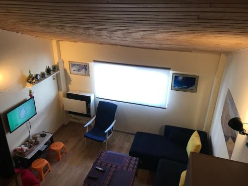 an overhead view of a living room with a large window at Room 46 in Gudauri