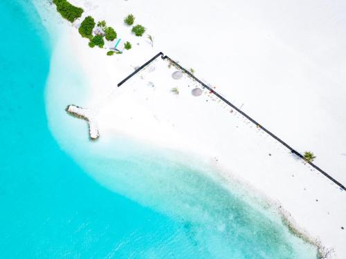 an aerial view of an island in the ocean at Mariana Maldives in Gaafaru