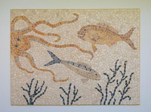 a mosaic of fish on a wall at Il Gamberino in Capraia