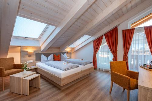 Postel nebo postele na pokoji v ubytování Boutique Hotel Angerer