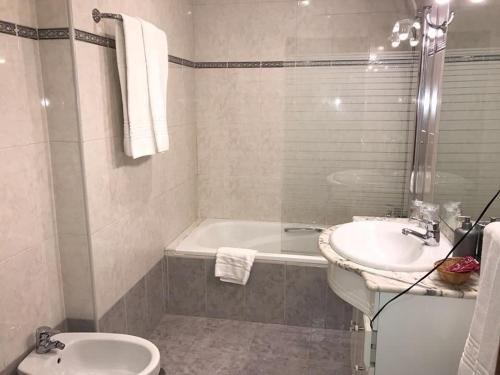 Un baño de Apartahotel Siglo XXI