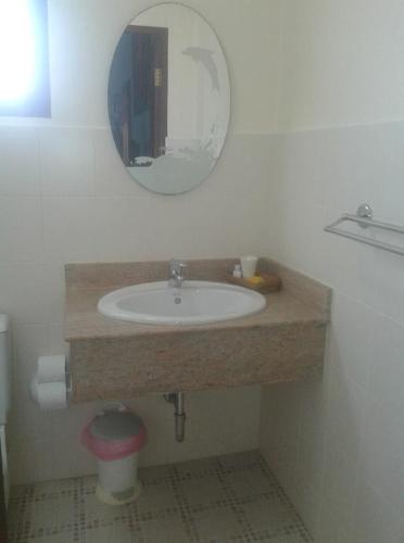 a bathroom with a sink and a mirror at Majestic Villas Guesthouse Phuket. in Rawai Beach