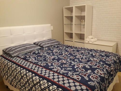 Ένα ή περισσότερα κρεβάτια σε δωμάτιο στο Olimpia Residencial Villaggio