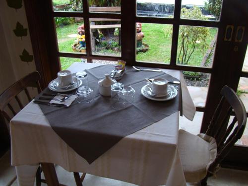 a table with a black and white table cloth on it at Alpenhaus Pousada in Campos do Jordão
