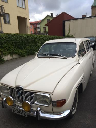 a white car parked in a parking lot at Hotell Bele in Trollhättan