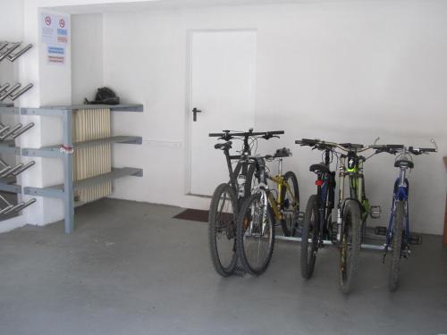 a group of bikes parked in a garage at Appartements Kroner in Nauders