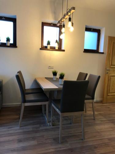 a dining room with a table and chairs at Haus Central Lofer in Lofer