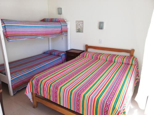 a bedroom with two bunk beds in a room at Parque Hotel in Santa Teresita