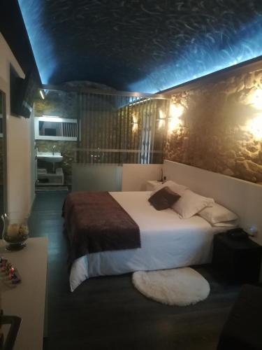 Ένα ή περισσότερα κρεβάτια σε δωμάτιο στο Casa O Gures